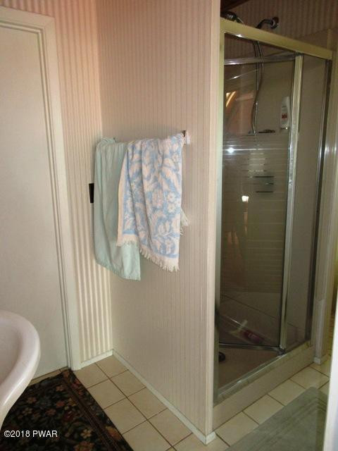 208 Rodeo Drive Hawley, PA 18428 - Photo 12 of 15 a bathroom with a shower and toilet