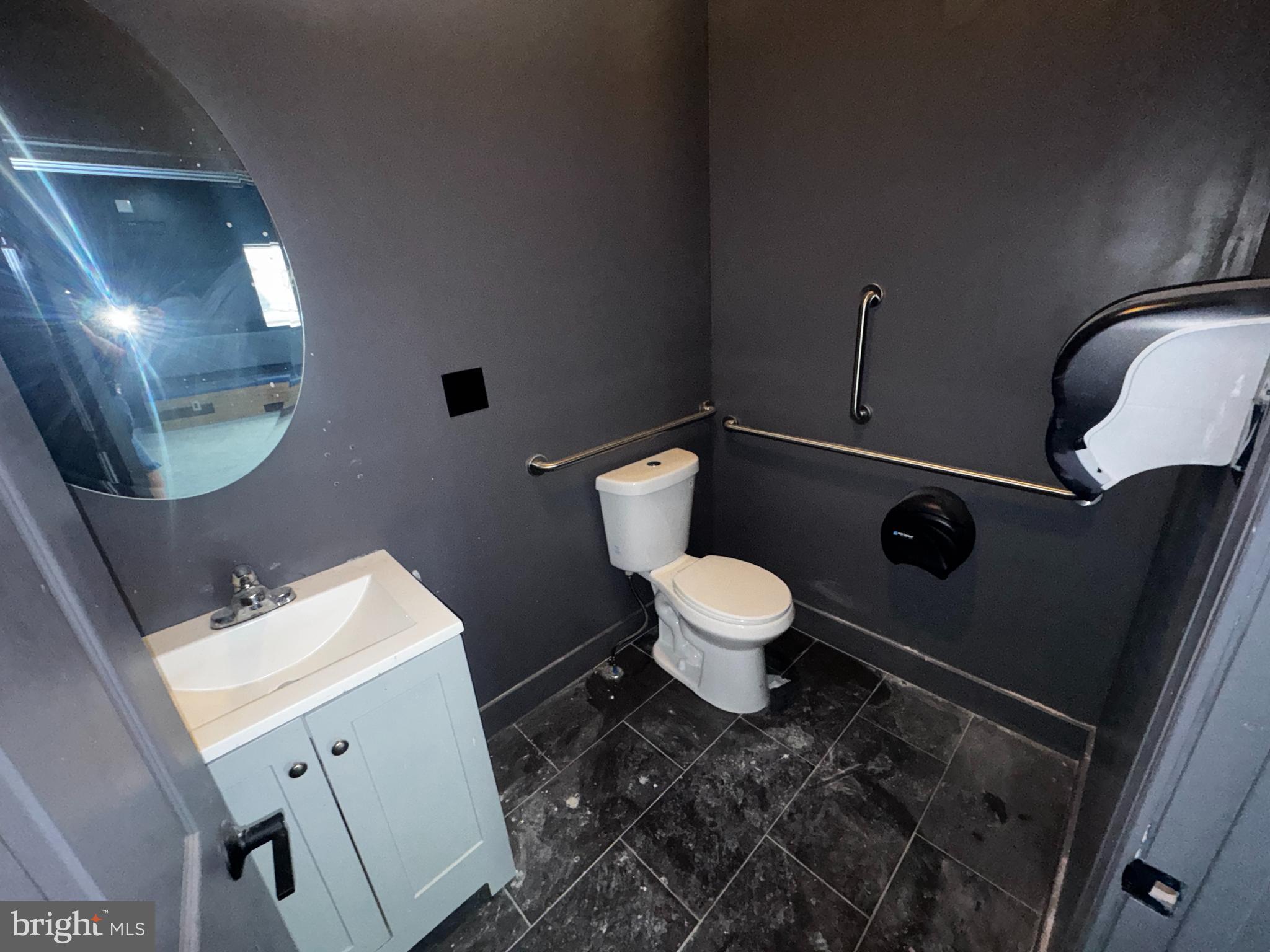 700 Lloyd Street Chester, PA 19013 - Photo 8 of 32 a bathroom with a toilet sink and mirror