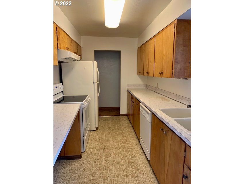 532 Northeast 37th Street Pendleton, OR 97801 - Photo 10 of 21 a kitchen with a sink and a refrigerator