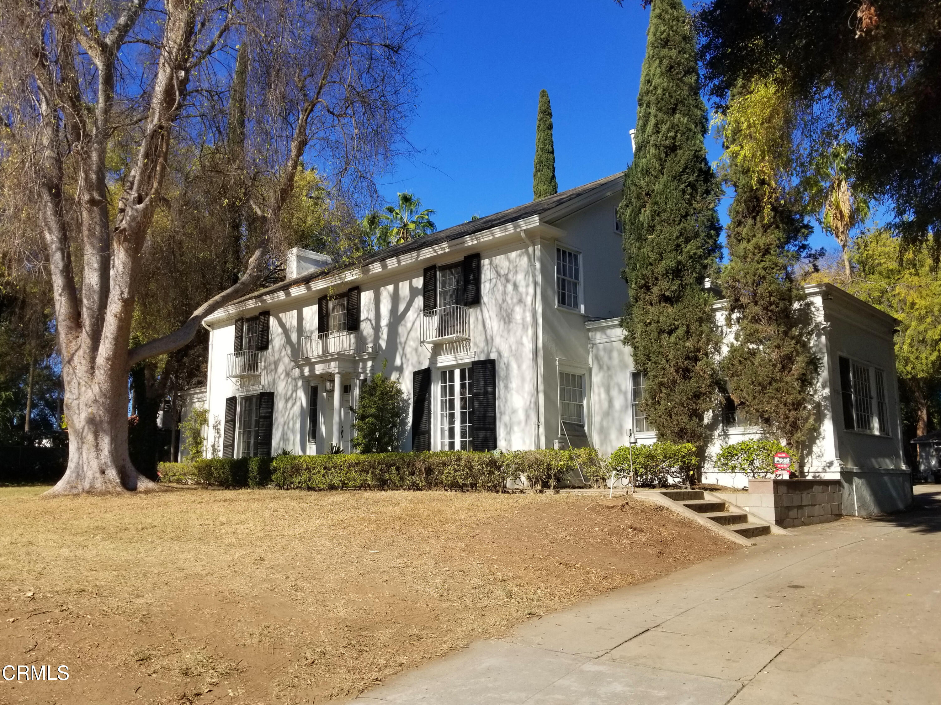 981 Arden Road Pasadena, CA 91106 - Photo 1 of 3 a front view of a building with large trees