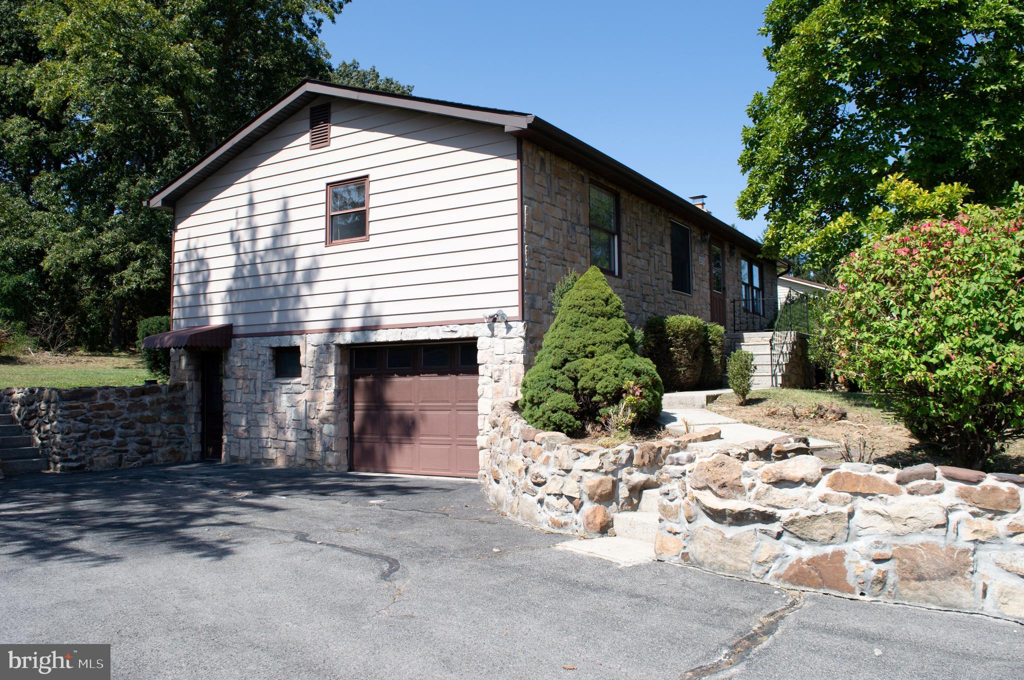 12713 Winchester Road Cumberland, MD 21502 - Photo 15 of 55 a view of a house with yard and sitting area