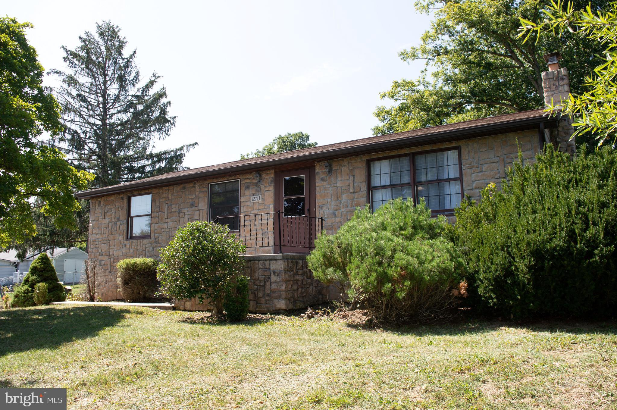 12713 Winchester Road Cumberland, MD 21502 - Photo 3 of 55 a view of a house with a yard and plants
