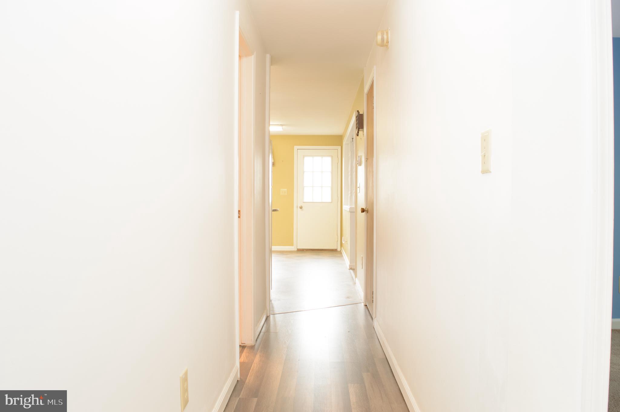 12713 Winchester Road Cumberland, MD 21502 - Photo 34 of 55 a view of a hallway with wooden floor