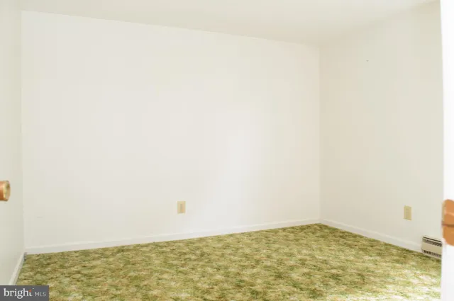 a view of a livingroom and a hallway