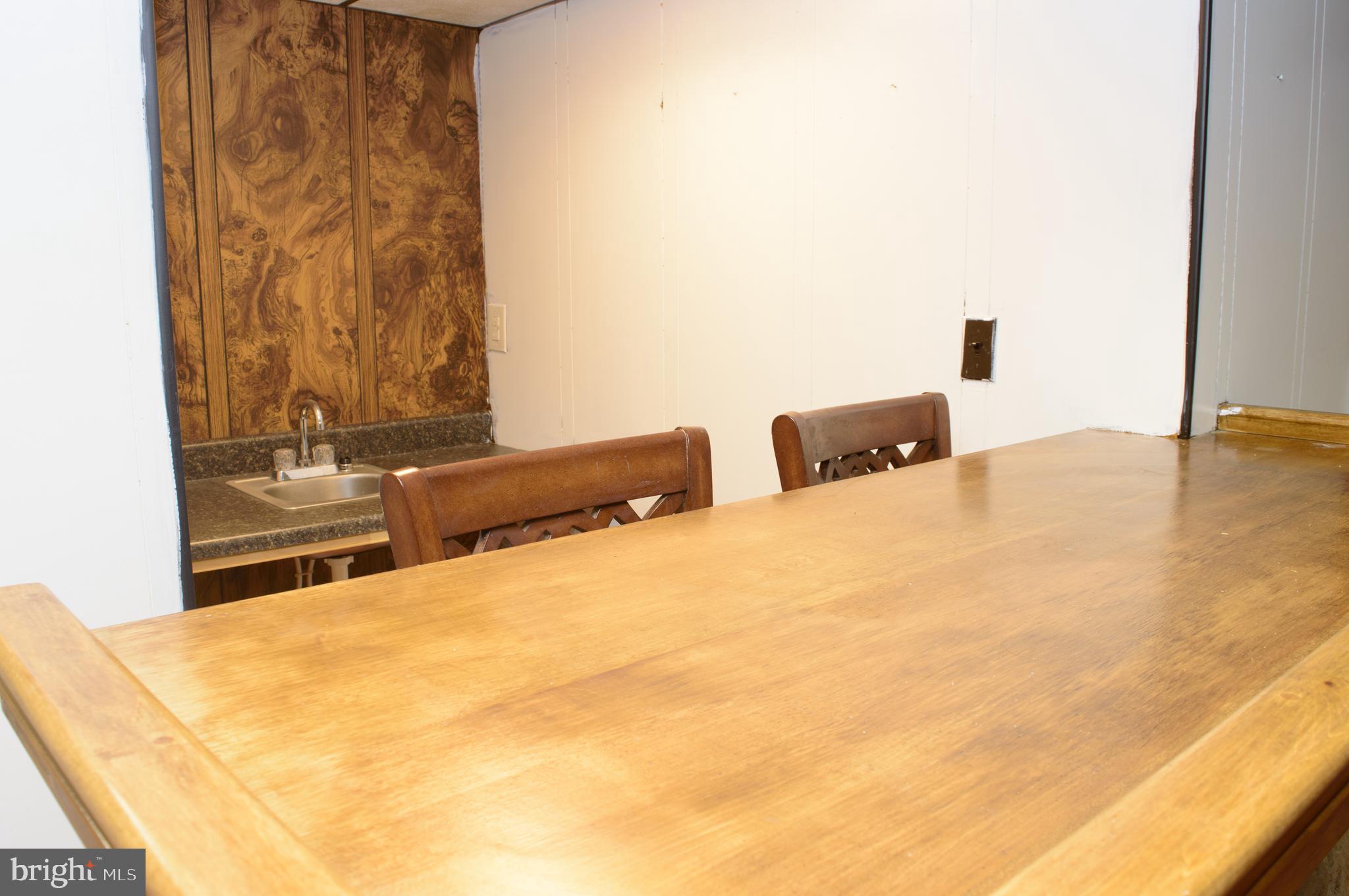 12713 Winchester Road Cumberland, MD 21502 - Photo 47 of 55 a bedroom with a bed and a night stand