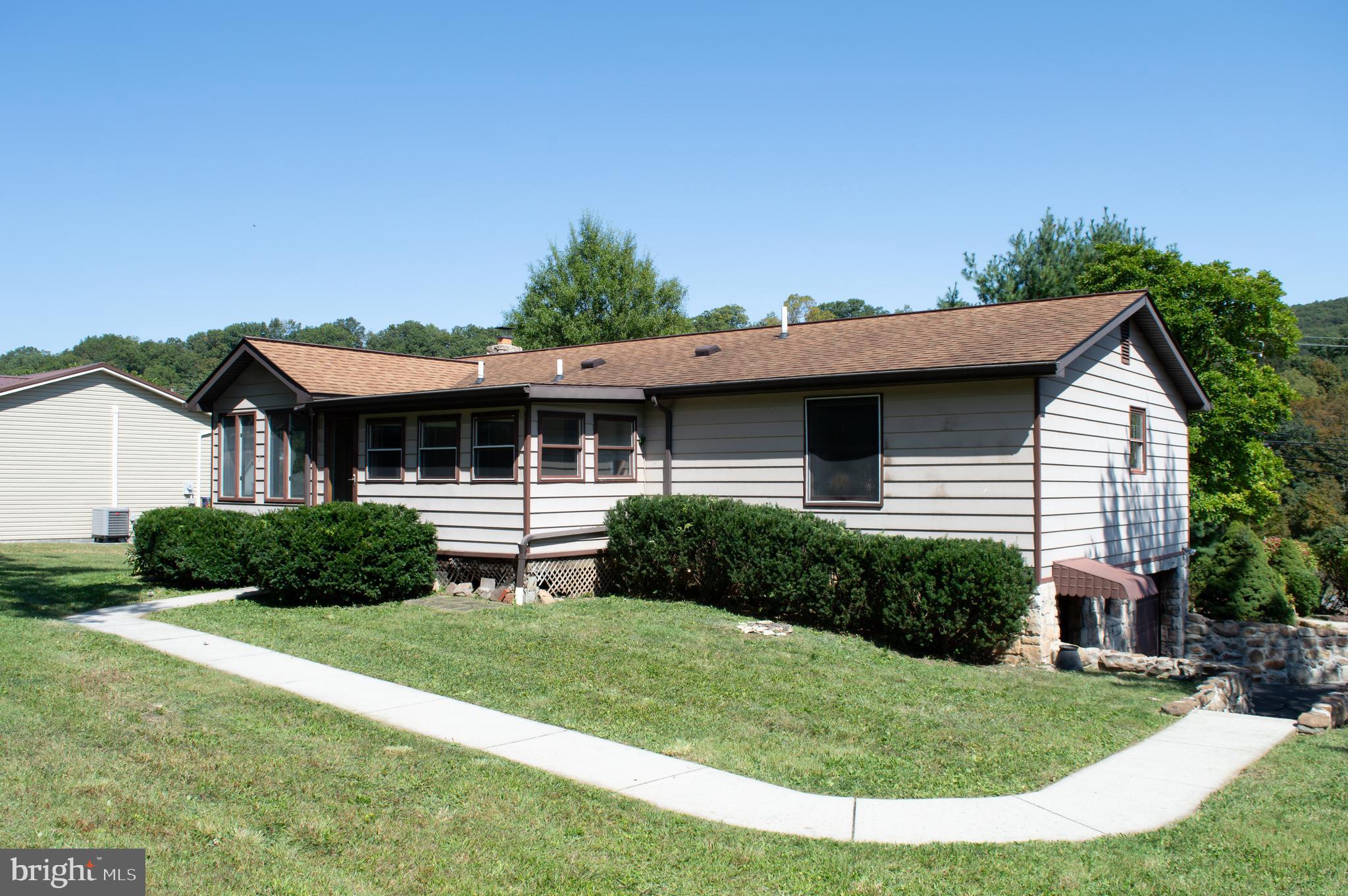 12713 Winchester Road Cumberland, MD 21502 - Photo 10 of 55 a view of an house with backyard space and garden
