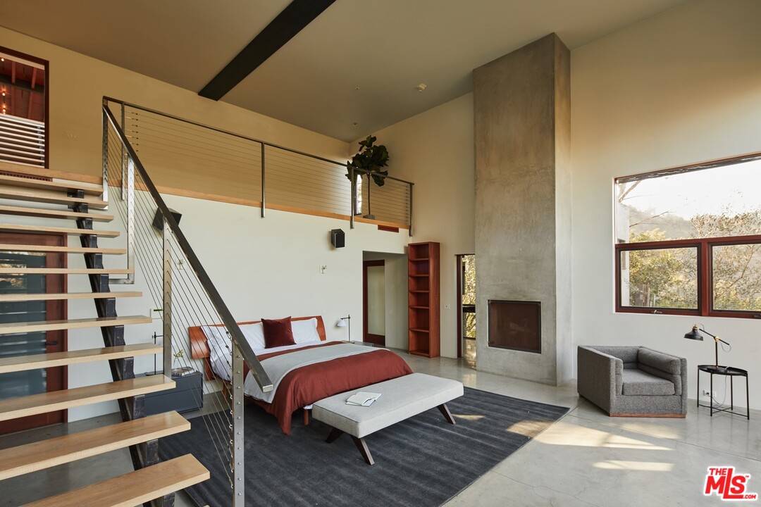 3201 Coldwater Canyon Lane Beverly Hills, CA 90210 - Photo 12 of 23 a bedroom with furniture and window