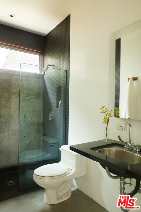 3201 Coldwater Canyon Lane Beverly Hills, CA 90210 - Photo 16 of 23 a bathroom with a sink toilet and shower