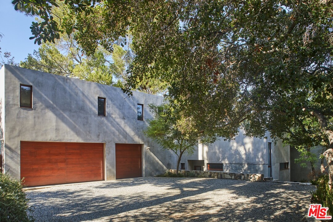 3201 Coldwater Canyon Lane Beverly Hills, CA 90210 - Photo 3 of 23 a view of a house with a tree
