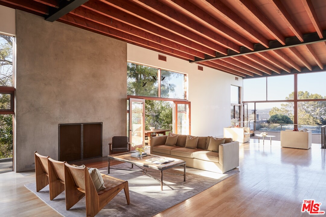 3201 Coldwater Canyon Lane Beverly Hills, CA 90210 - Photo 6 of 23 a living room with furniture and a fireplace