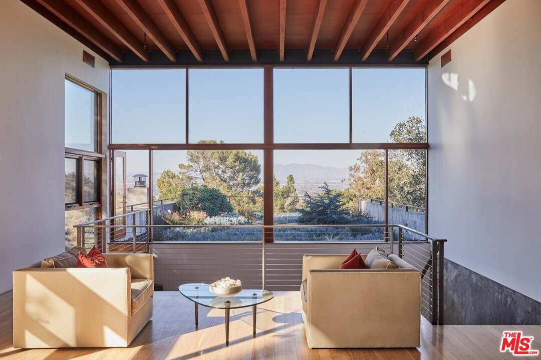 3201 Coldwater Canyon Lane Beverly Hills, CA 90210 - Photo 7 of 23 a living room with furniture and a window