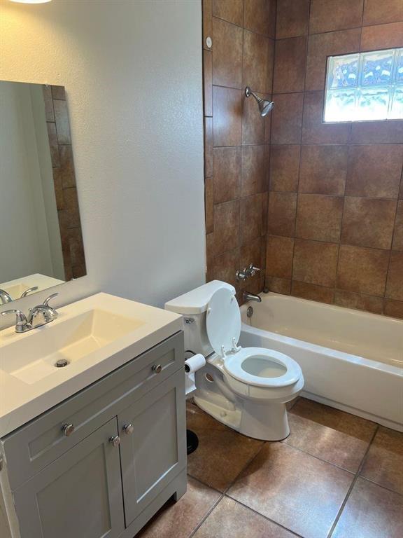 1209 Bawcom Street Sweetwater, TX 79556 - Photo 10 of 10 a bathroom with a sink toilet and shower