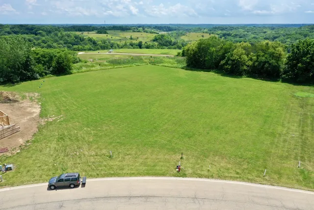 a view of a field with an ocean view