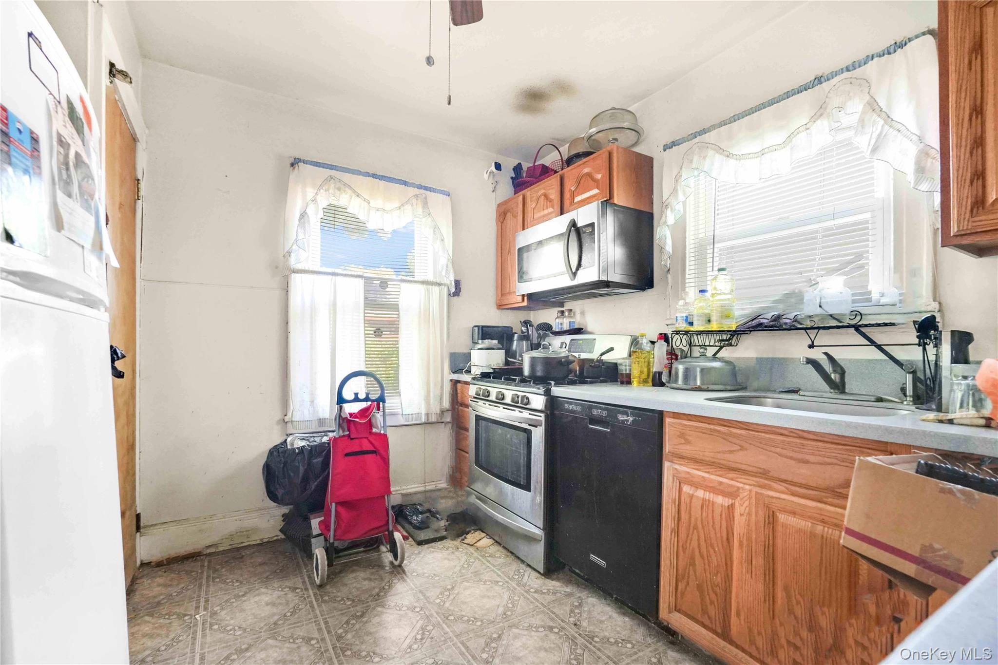 190-63 112th Avenue Queens, NY 11412 - Photo 3 of 11 a kitchen with a sink stove and refrigerator