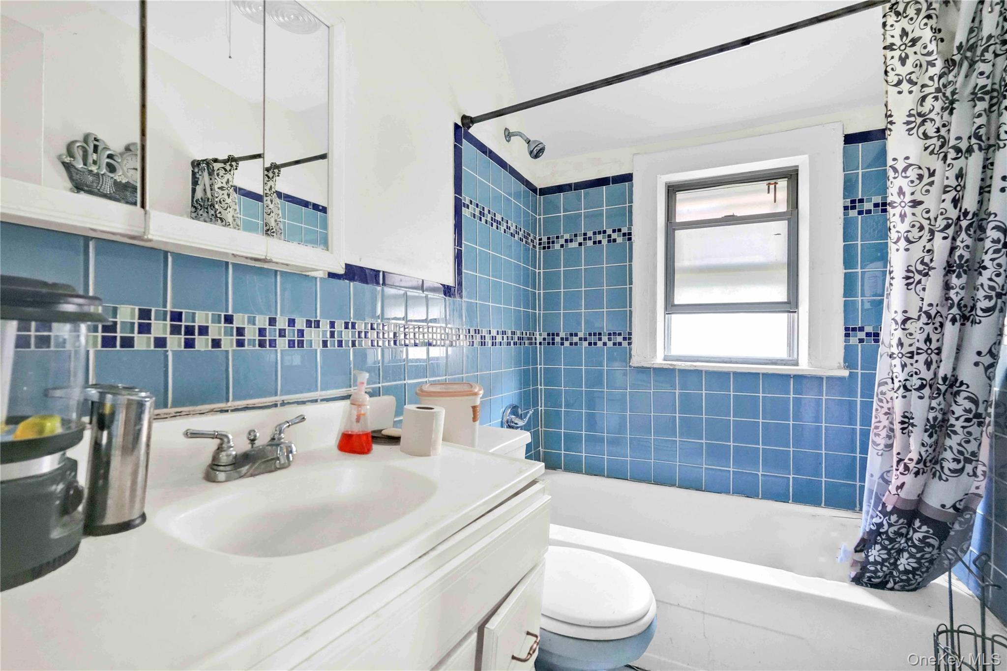 190-63 112th Avenue Queens, NY 11412 - Photo 5 of 11 a bathroom with a sink a toilet and bathtub