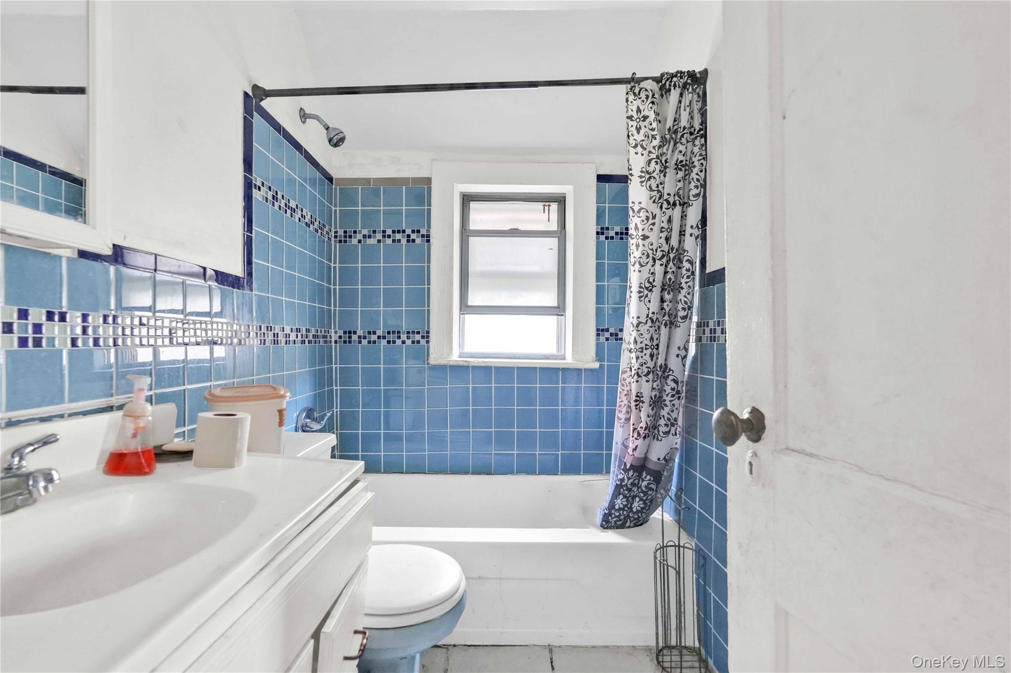 190-63 112th Avenue Queens, NY 11412 - Photo 6 of 11 a bathroom with a sink a toilet and shower
