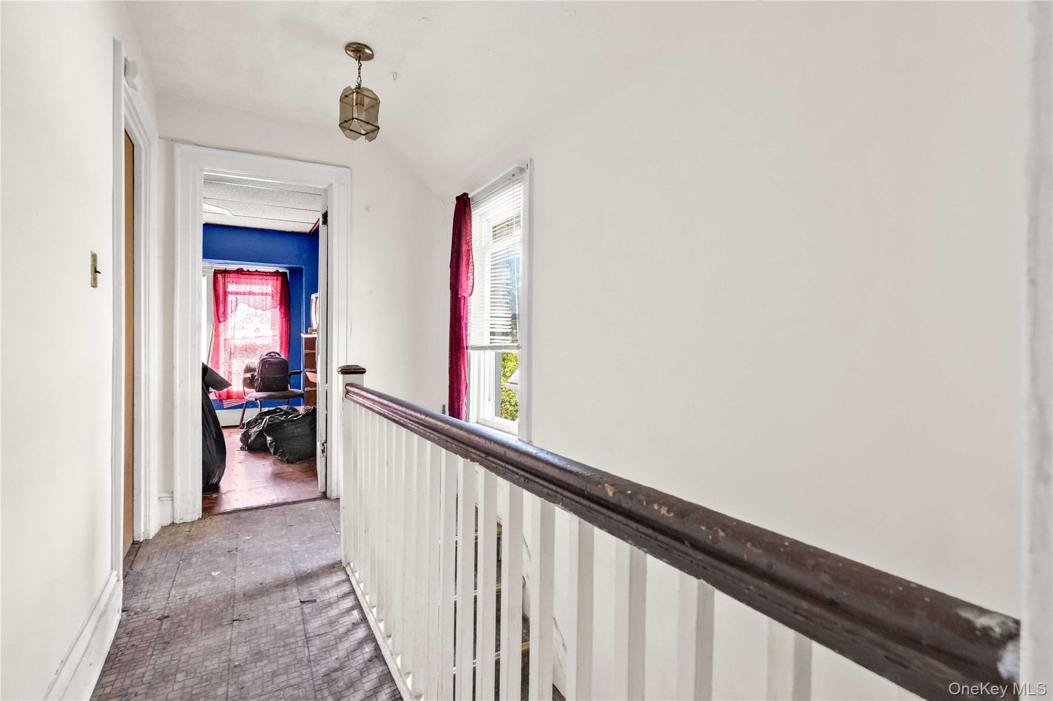 190-63 112th Avenue Queens, NY 11412 - Photo 7 of 11 a view of a hallway and a livingroom with furniture