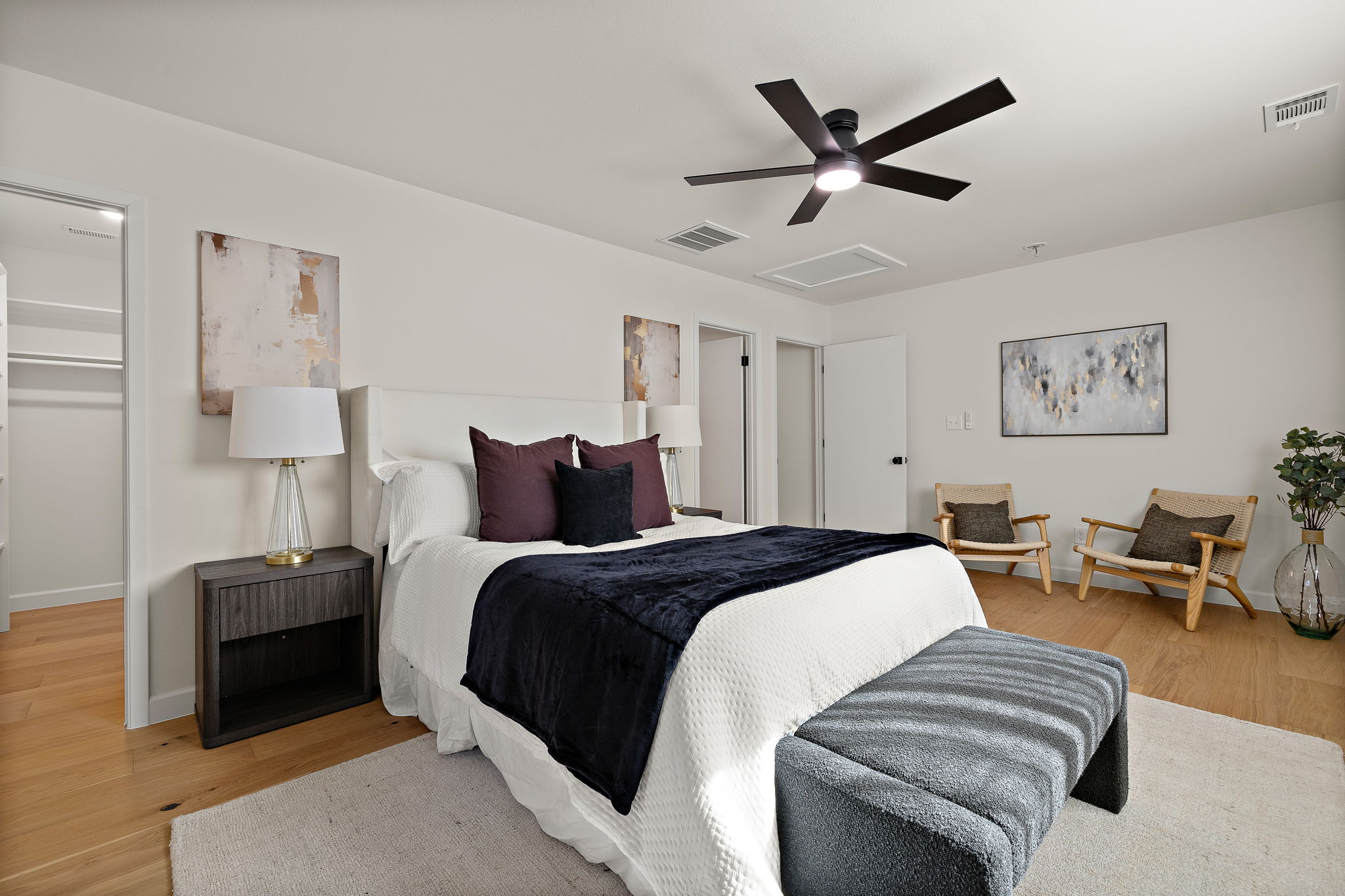8102 Burrell Drive Austin, TX 78757 - Photo 20 of 35 a bed room with a bed and a ceiling fan