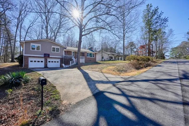 a view of a town with large trees