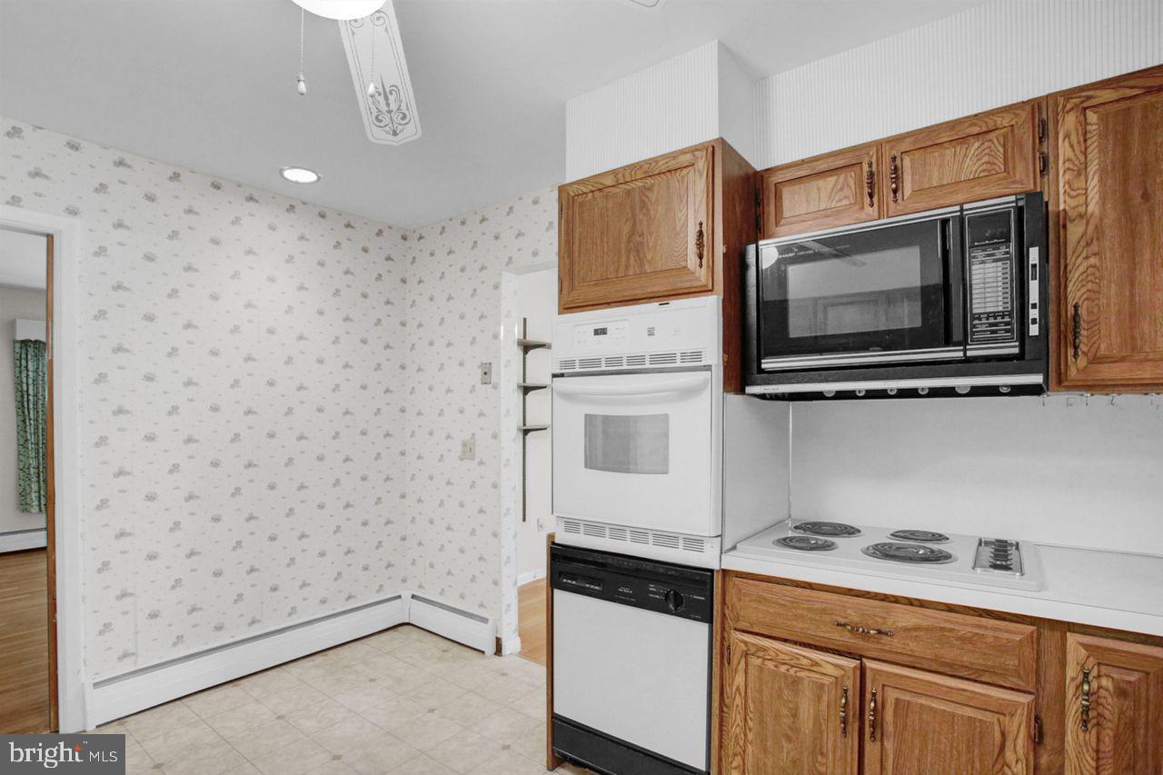 3409 River Road Reading, PA 19605 - Photo 12 of 41 a kitchen with stainless steel appliances a cabinets and a stove top oven