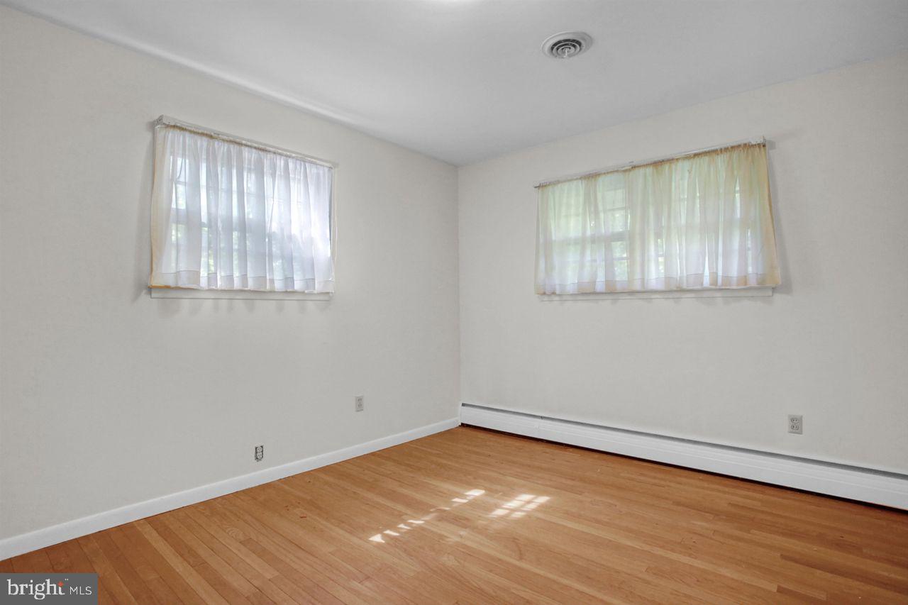 3409 River Road Reading, PA 19605 - Photo 19 of 41 a view of an empty room with wooden floor and a window