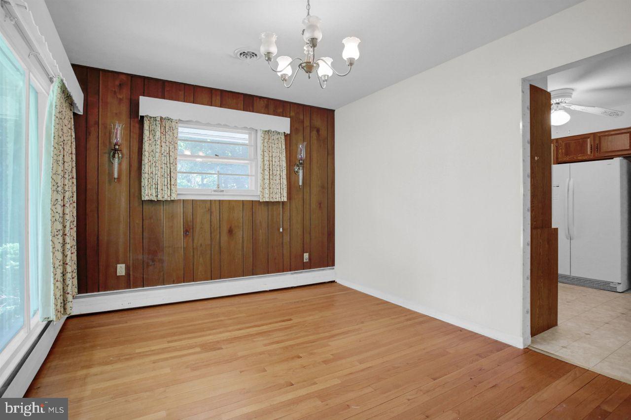 3409 River Road Reading, PA 19605 - Photo 7 of 41 wooden floor in an empty room with a window