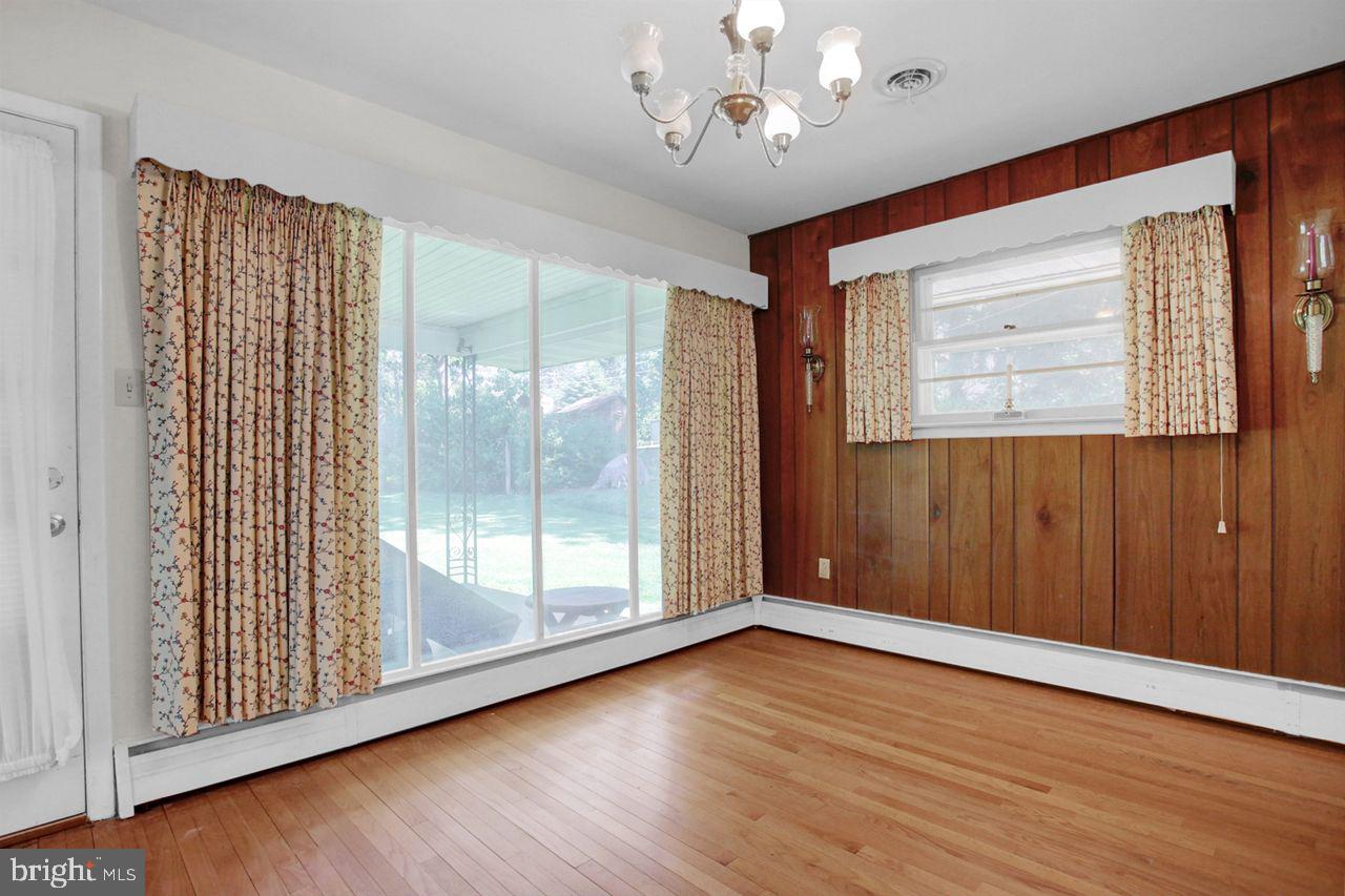 3409 River Road Reading, PA 19605 - Photo 8 of 41 an empty room with wooden floor and windows