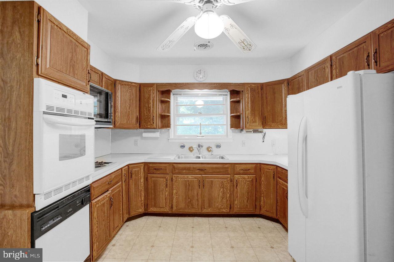 3409 River Road Reading, PA 19605 - Photo 10 of 41 a kitchen with a sink refrigerator and cabinets