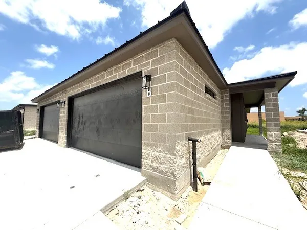 a view of house with backyard