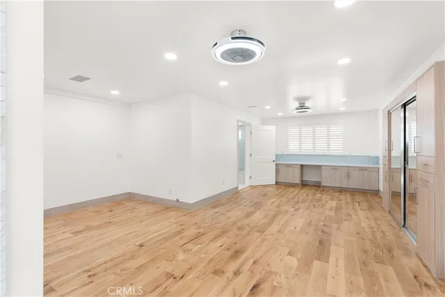 a spacious bathroom with a double vanity sink a mirror and a shower