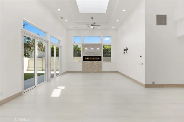 a kitchen with stainless steel appliances kitchen island granite countertop a stove and a sink