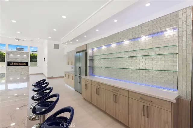 a view of an empty room with a ceiling fan