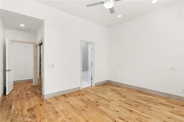 an aerial view of multiple houses with a yard