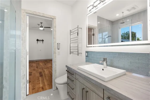 an aerial view of a residential houses with city view