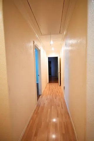 a view of hallway with an empty room