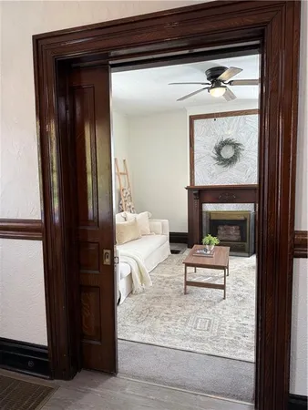 a living room with furniture and a fireplace