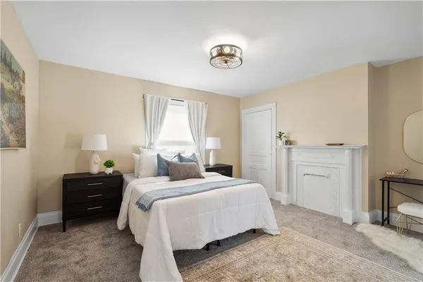 a bedroom with a bed and a view of bathroom