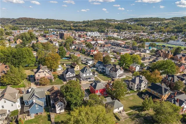 an aerial view of residential houses with outdoor space