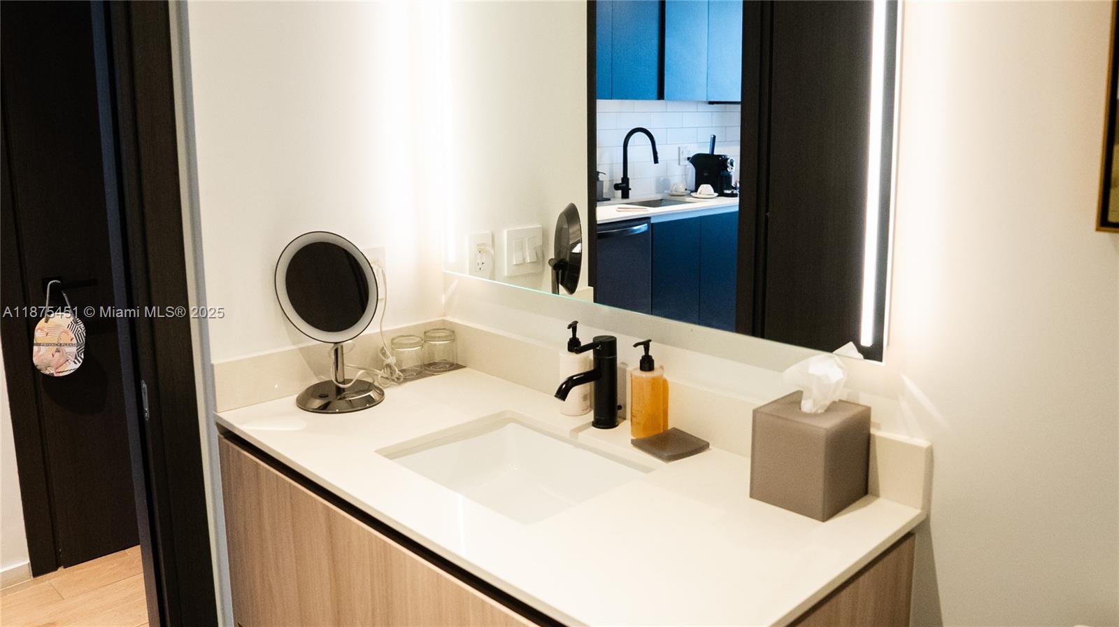 a kitchen with a sink cabinets and appliances