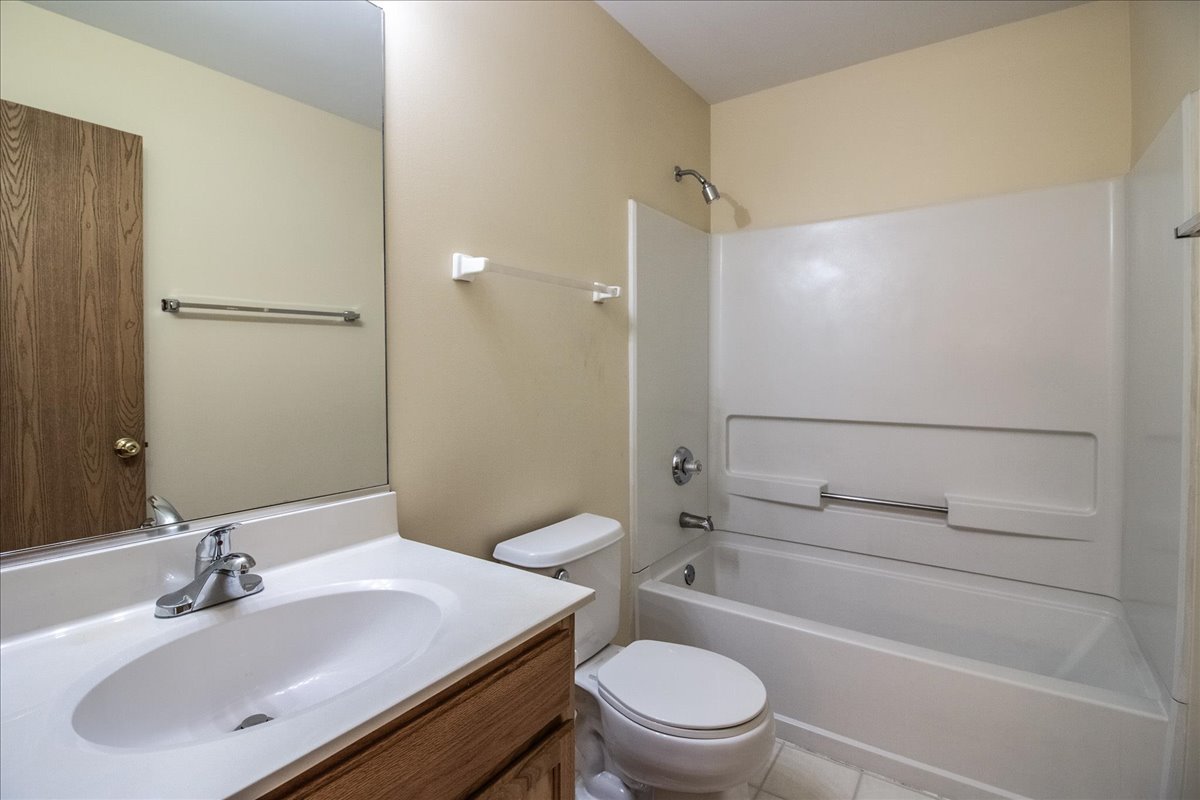2306 Reflections Drive Aurora, IL 60502 - Photo 3 of 6 a bathroom with a sink toilet vanity and shower