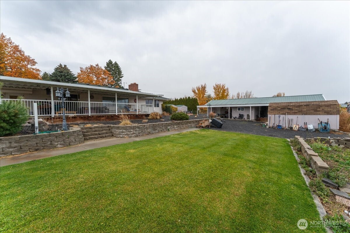 20271 Linden Road Northwest Soap Lake, WA 98851 - Photo 14 of 22 a view of a house with a backyard and a patio