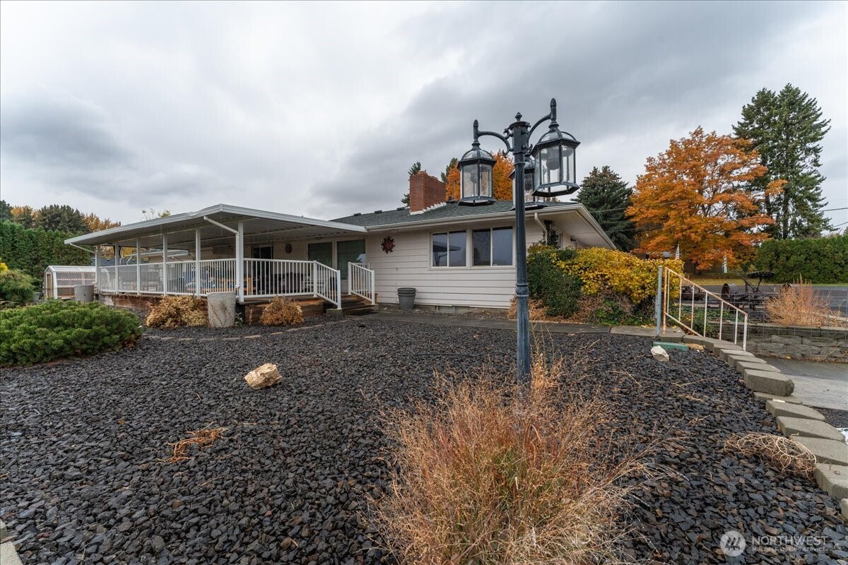 20271 Linden Road Northwest Soap Lake, WA 98851 - Photo 15 of 22 a view of a house with a backyard and porch