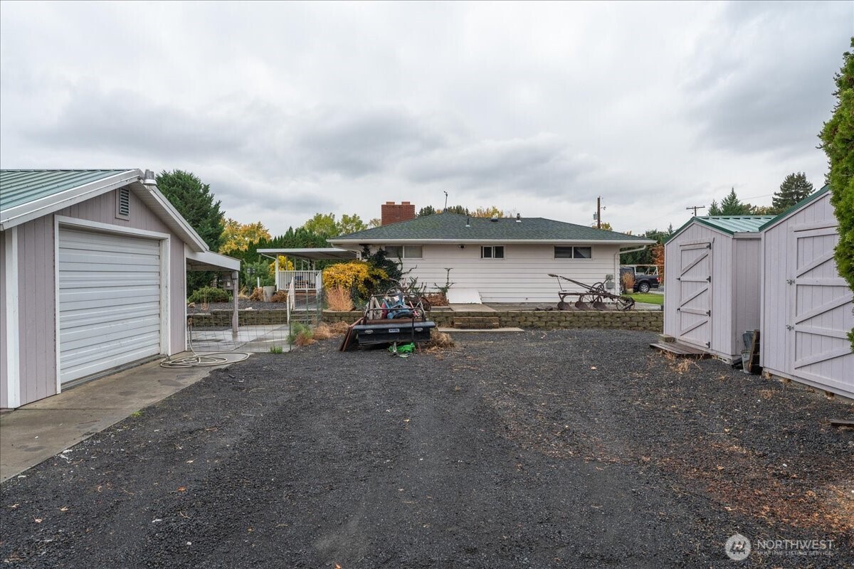 20271 Linden Road Northwest Soap Lake, WA 98851 - Photo 9 of 22 a view of a house with backyard and utility