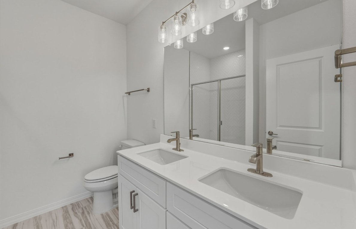 472 Tailwind Drive Kyle, TX 78640 - Photo 10 of 22 a bathroom with a sink toilet and shower