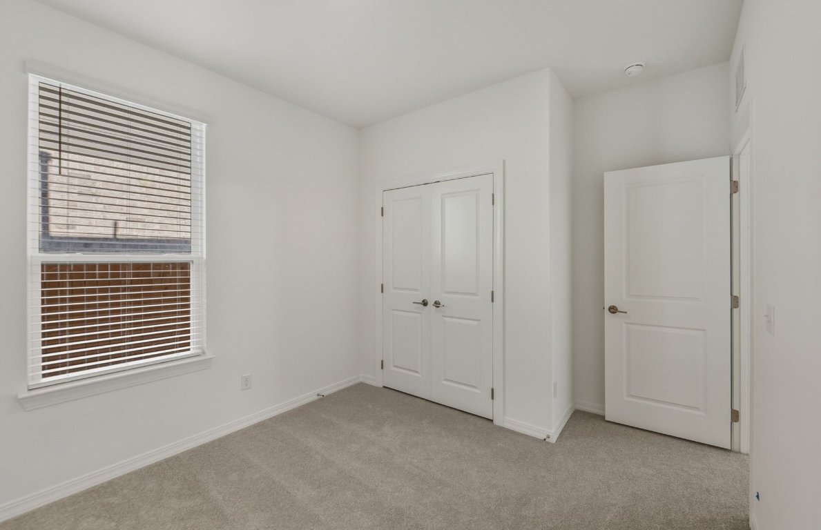 472 Tailwind Drive Kyle, TX 78640 - Photo 13 of 22 a view of room and window