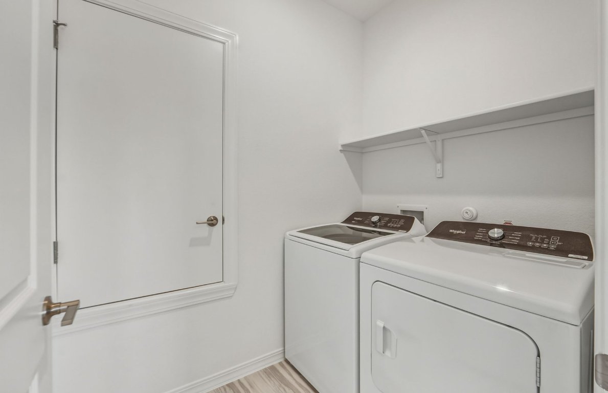 472 Tailwind Drive Kyle, TX 78640 - Photo 14 of 22 a utility room with dryer and washer