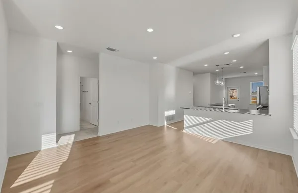 a view of kitchen with furniture and wooden floor