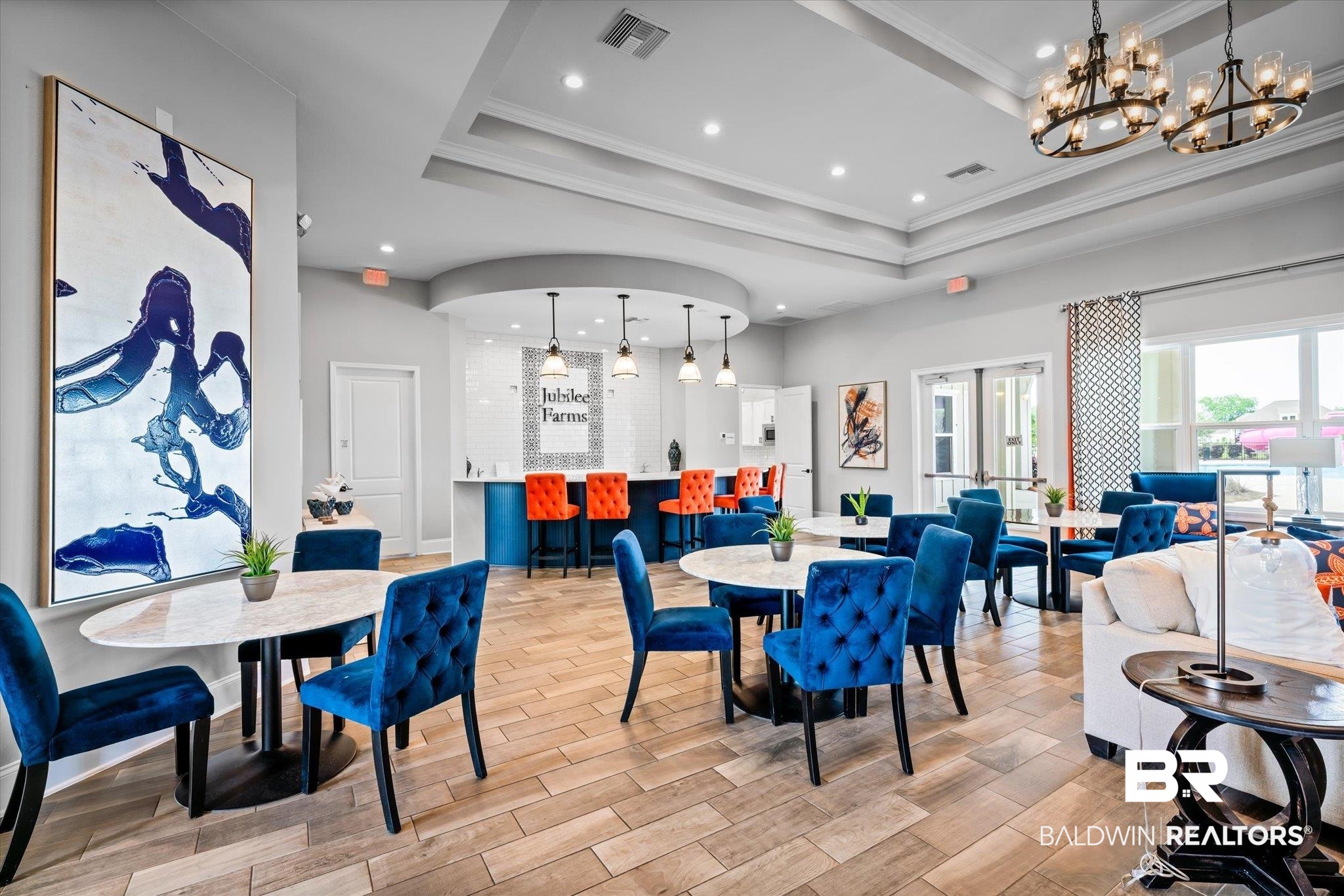 24262 Alydar Loop Daphne, AL 36526 - Photo 20 of 33 Dining space featuring a tray ceiling, wood finish floors, and visible vents
