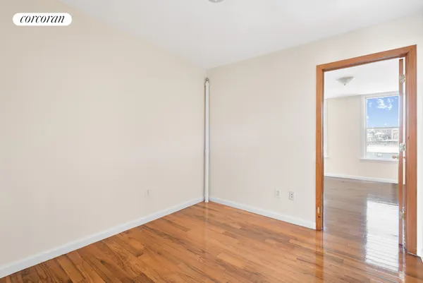 a view of an entryway with wooden floor