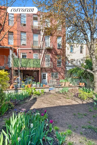 a front view of a building with brick walls